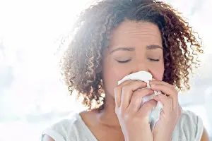 Allergy Prints: Woman blowing nose on tissue