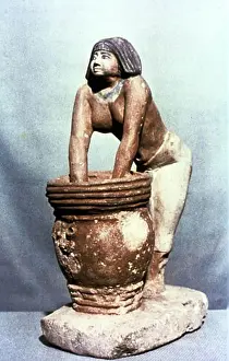 Beer Prints: Woman brewing beer. Ancient Egyptian tomb model. Cairo Museum, Egypt