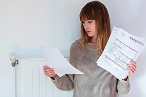 Bill Prints: Woman checking her heat consumption