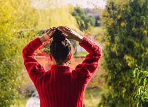 Woody Plant Prints: woman from behind combing her bun looking out the window