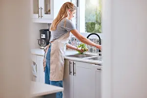 Vegetables Prints: Woman, cooking and cleaning food or vegetable with water under kitchen tap for healthcare