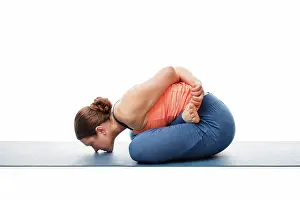 Isolated Prints: Woman doing Asthanga Vinyasa Yoga asana Yoga mudrasana (yoga mudra) - psychic union pose isolated on white background