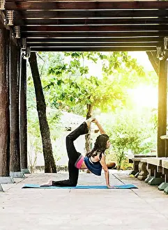 Exercises Prints: Woman doing quadriceps yoga outdoors, girl doing yoga and quadricep stretching fitness