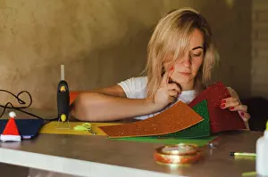 Holidays Prints: woman examines foamiran for decor