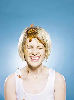 Colored Background Prints: woman getting food dumped on her head