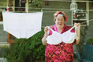Eye Glasses Prints: Woman hanging oversized underwear on a clothesline