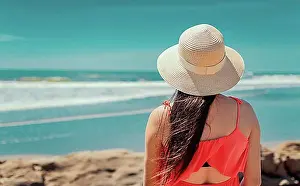 Rear Views Prints: Woman in hat from back to the sea