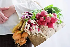 Mixed Prints: Woman holding basket of beetroot and radishes