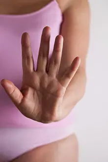 Vulnerability Prints: Woman holding hand out towards camera