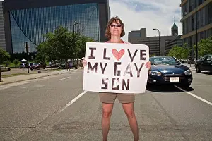 City Location Prints: Woman holding a placard in a gay pride parade, Minneapolis, Minnesota, USA