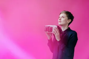 : Woman holding VR glasses