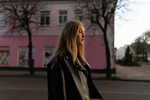 Generation Y Prints: A woman in a leather jacket walks around the city