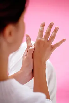 Alternative Therapy Prints: Woman massaging her hands