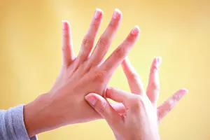 Alternative Therapy Prints: Woman massaging her hands