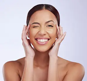 Facial Prints: Woman portrait, beauty wink and skincare in a studio with happiness and smile from dermatology