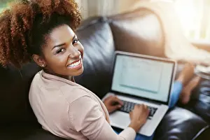 Typing Prints: Woman, portrait or happy with laptop on sofa for internet browsing