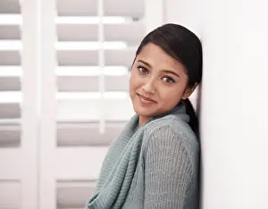Woman, portrait and smile in a new home on the floor and carpet relax in the morning