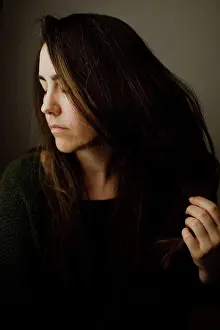 Thoughtful Prints: Woman in Profile with Eyes Closed and Hand in Hair