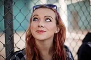 20 To 25 Years Prints: Woman with red hair looking up
