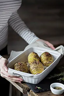 Roasted Prints: Woman with roasted hasselback potatoes