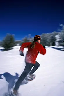Warm Clothing Prints: A woman running on snowshoes in Lake Tahoe, California (Blurred Motion)