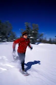 Warm Clothing Prints: A woman running on snowshoes in Lake Tahoe, California (Blurred Motion)