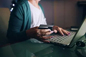 Senior Women Prints: Woman shopping on laptop with credit card