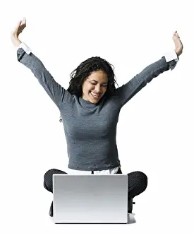 One Object Prints: Woman sitting cross legged with laptop stretching