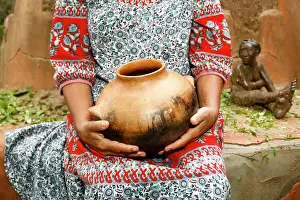 Tableware Prints: Woman sitting and holding clay pot