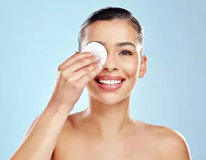 Cleaning Prints: Woman, skincare and cotton pad with studio portrait for makeup