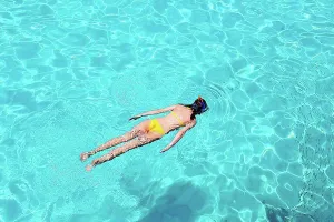 Snorkel Prints: Woman snorkeling in crystal clear turquoise water at tropical beach
