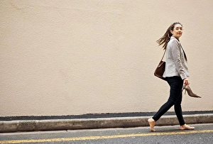 Heels Prints: Woman in street, walking at wall with mockup and barefoot