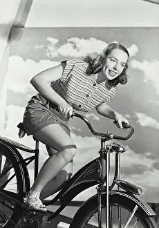 Blouse Prints: Woman in stripped blouse smiling on bicycle