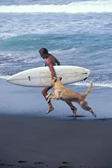 Surfing Prints: Woman surfer and dog running, Costa Rica