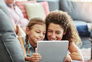 Tablet Prints: Woman, tablet and kid in watching as family on weekend