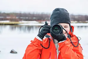 Explorations Prints: woman taking picture with digital mirrorless camera