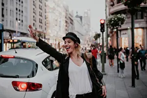 Taxi Prints: Woman taking taxi in city