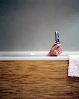 Texting Prints: Woman text messaging in bath