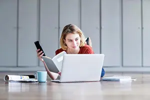 Wifi Prints: Woman using a laptop and a smartphone