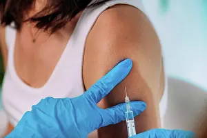 Vaccine Prints: Woman being vaccinated