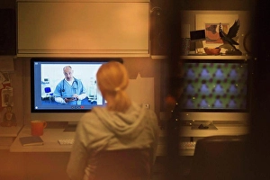 Mental Health Prints: Woman video conferencing with doctor on computer screen