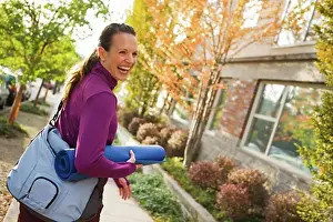 25 To 30 Years Prints: Woman Walking and Carrying Yoga Mat, Seattle, Washington, USA