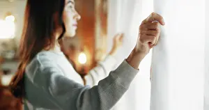 Thoughtful Prints: Woman, window and open curtains in home for start day