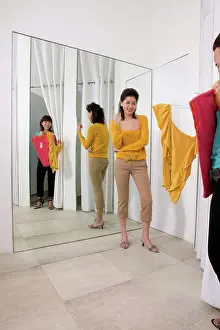 Assistant Prints: Two women in clothes store