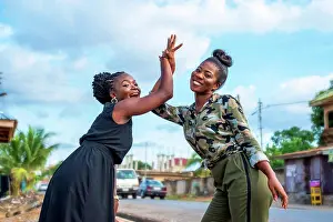 Ghana Prints: Women high-fiving