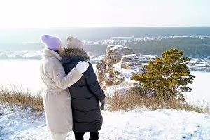 Hike Prints: Women hugging each other stand in front of White Rocks