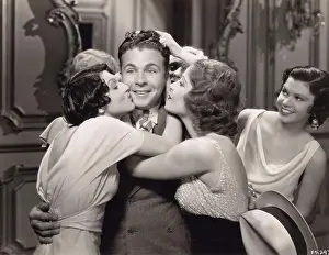 Exciting Prints: Women kissing Dick Powell, from 'Gold Diggers of 1933', Exclusive in your city