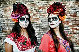 Chic Prints: Women near brick wall wearing skull face paint