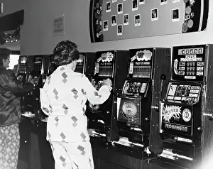 Nevada Prints: Women playing slot machines in a casino, Las Vegas, Nevada, USA