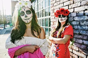 Chic Prints: Women on sidewalk wearing skull face paint